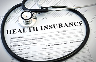 Health insurance form and stethoscope