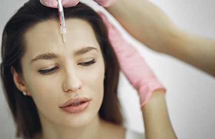 Woman having injection for Botox.