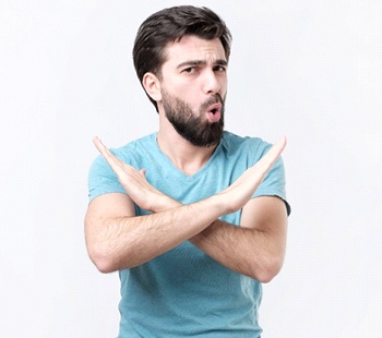 Man saying no to “cheap” cosmetic facial fillers