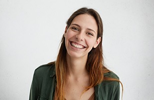 Woman smiling after successful earlobe repair in Chicago