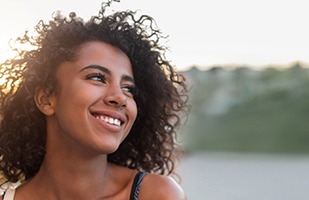 Smiling woman, happy she could afford earlobe repair