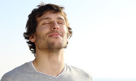 Man taking deep breath through his nose