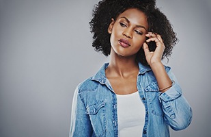 Portrait of young woman considering cost of otoplasty in Chicago