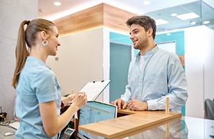 Man paying for treatment in medical clinic