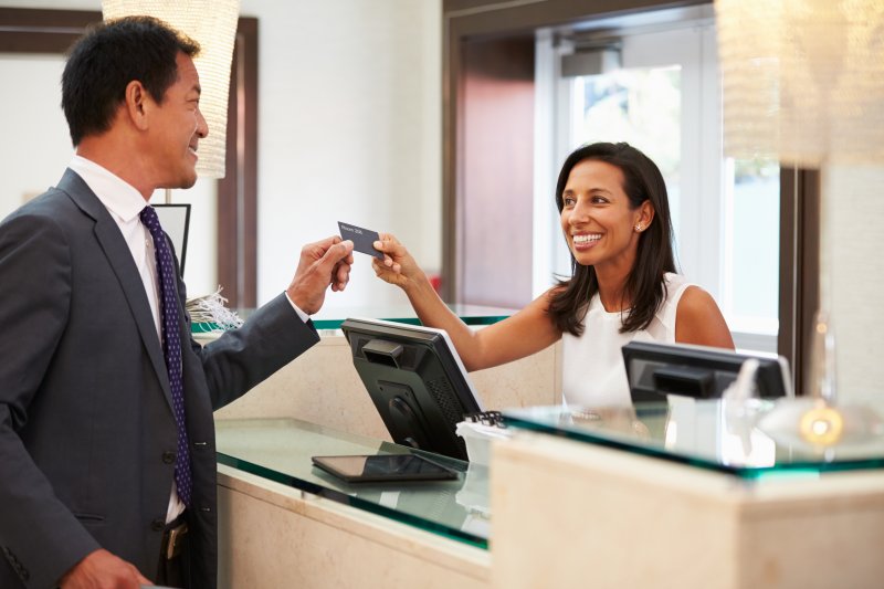 A patient discussing payment options in Chicago with an employee.