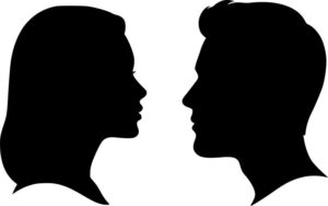 Silhouette of man and woman facing each other 