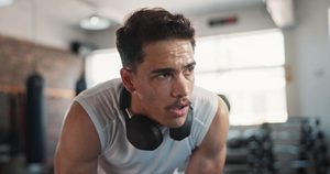 Sweaty man breathing through his mouth during workout